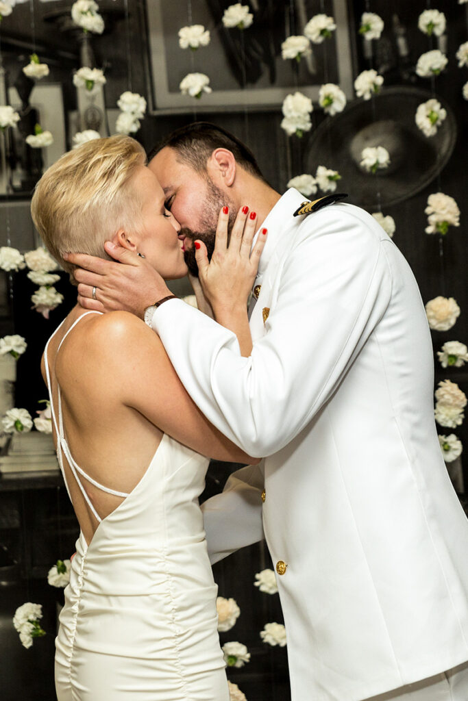 Bride and groom share their first kiss as husband and wife at the chic SLS South Beach hotel in Florida.