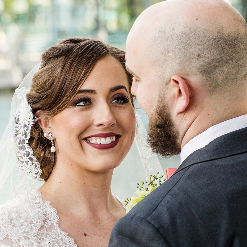 Bride beams with joy as she lovingly gazes at her new husband across from Lake Terrace Wedding Venue, Boca Raton.